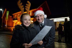Barratt Tarleton Locks, Plox Brow, PRESTON Barratt has invited local primary school to sing Christmas carols at its development to celebrate first xmas for most residents Pictured Milly Johnson aged 7 with Barratt sales adviser Lee Bowers